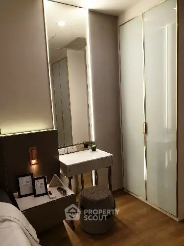 Modern bedroom with sleek design and elegant lighting