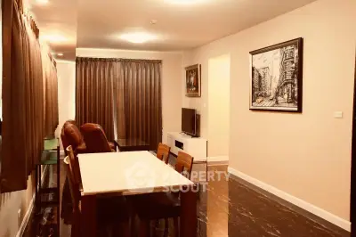 Spacious living room with elegant decor and ample natural light, perfect for relaxation and entertainment.