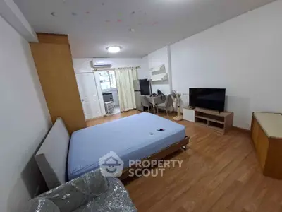 Spacious bedroom with modern furnishings and natural light, ideal for comfortable living.