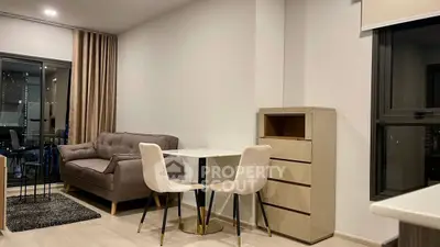 Modern living room with cozy sofa and dining area in stylish apartment.