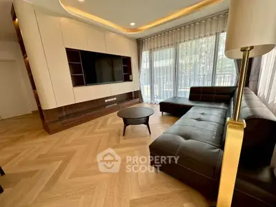 Luxurious modern living room with sleek leather sofa and elegant wood flooring