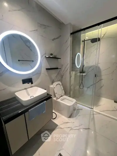 Luxurious modern bathroom with marble tiles and sleek fixtures