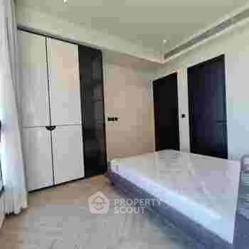 Modern bedroom with sleek design and spacious wardrobe