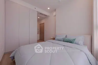 Spacious modern bedroom with cozy bedding and ample closet space