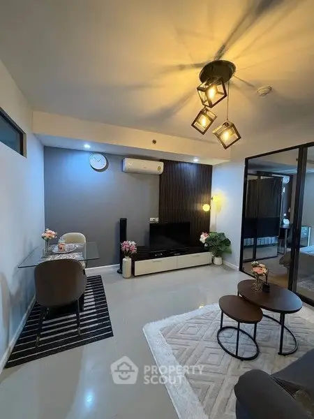 Modern living room with stylish decor and elegant lighting