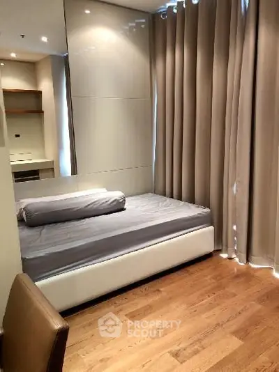 Cozy bedroom with modern decor and wooden flooring
