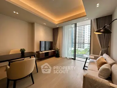 Modern living room with elegant decor and large window view in luxury apartment.