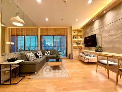 Modern living room with stylish decor, wooden flooring, and city view through large windows.