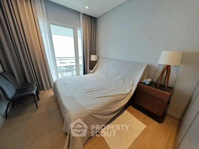 Modern bedroom with balcony access and stylish decor