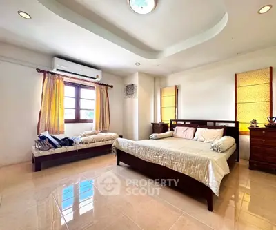 Spacious bedroom with elegant wooden furniture and natural light