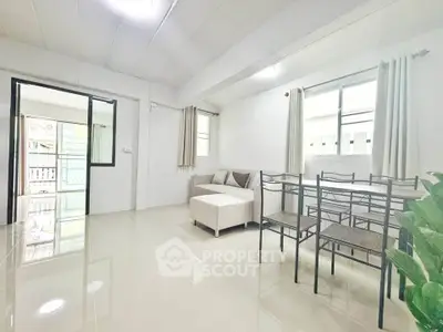 Bright and airy living room with modern furniture and large windows in a contemporary apartment.