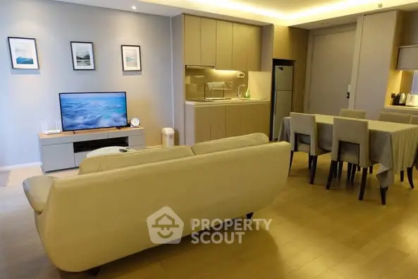 Modern open-plan living room with stylish kitchen and dining area