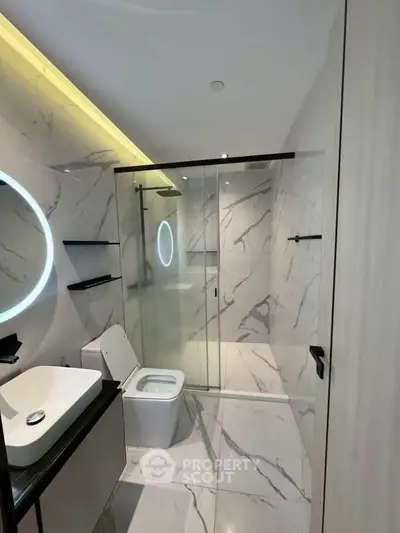 Luxurious modern bathroom with marble tiles and sleek fixtures