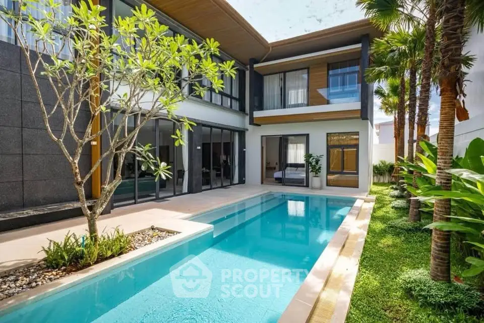 Luxurious modern villa with private pool and lush garden, perfect for serene living.
