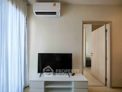 Modern living room with air conditioning and sleek TV setup