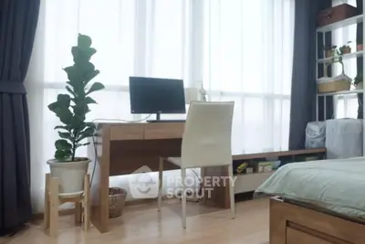 Modern study area with wooden desk and large window, perfect for productivity.