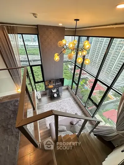 Luxurious duplex living room with floor-to-ceiling windows and stunning city view
