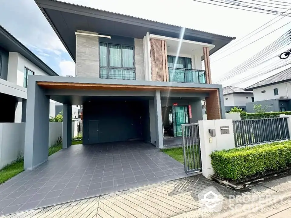 Modern two-story house with spacious driveway and stylish facade in suburban neighborhood.