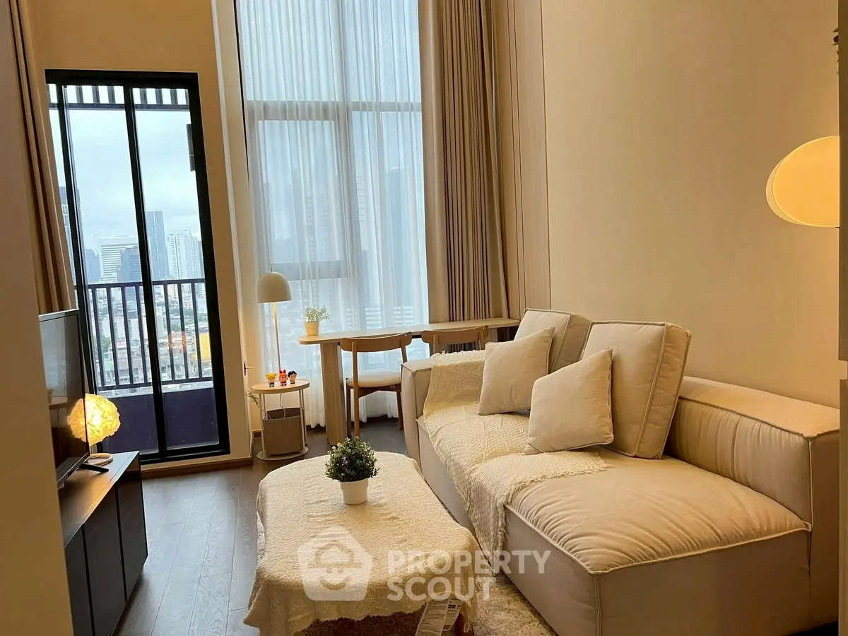 Modern living room with cozy sofa and city view balcony in high-rise apartment