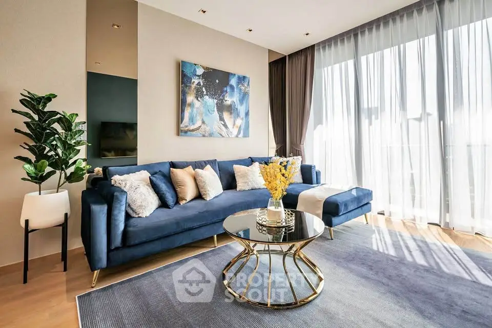 Luxurious modern living room with elegant blue sofa and stylish decor