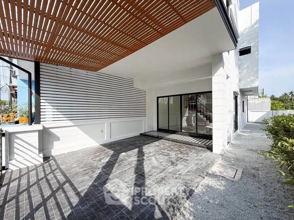Modern exterior with sleek design and spacious patio area, perfect for outdoor living.