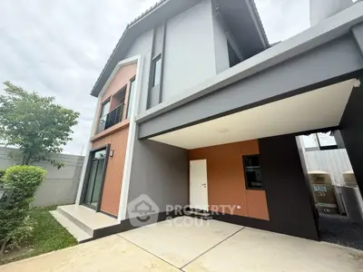 Modern two-story house exterior with sleek design and spacious driveway