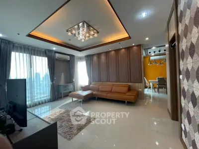Luxurious living room with modern decor and spacious layout in high-rise apartment.