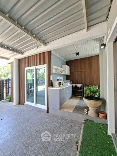 Modern outdoor kitchen with sleek design and natural light
