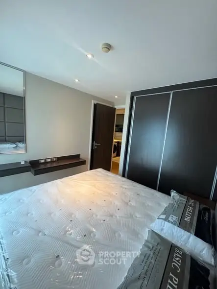 Modern bedroom with sleek design and ample natural light