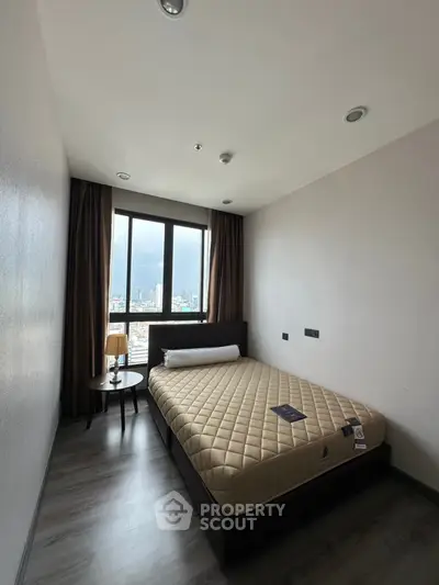 Cozy bedroom with city view and modern furnishings