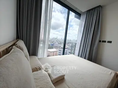 Modern bedroom with stunning city view from large window