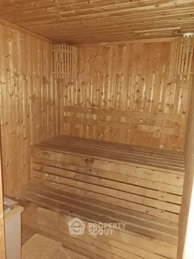 Cozy wooden sauna interior with warm ambiance and seating benches