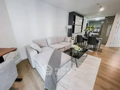 Modern living room with elegant decor and open dining area