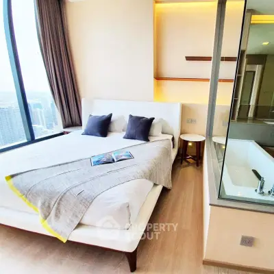 Luxurious bedroom with city view and modern bathtub, perfect for relaxation and comfort.