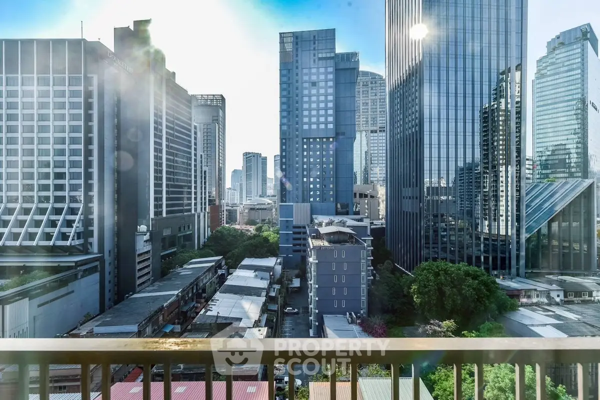 Stunning cityscape view from a high-rise balcony in a modern urban setting.