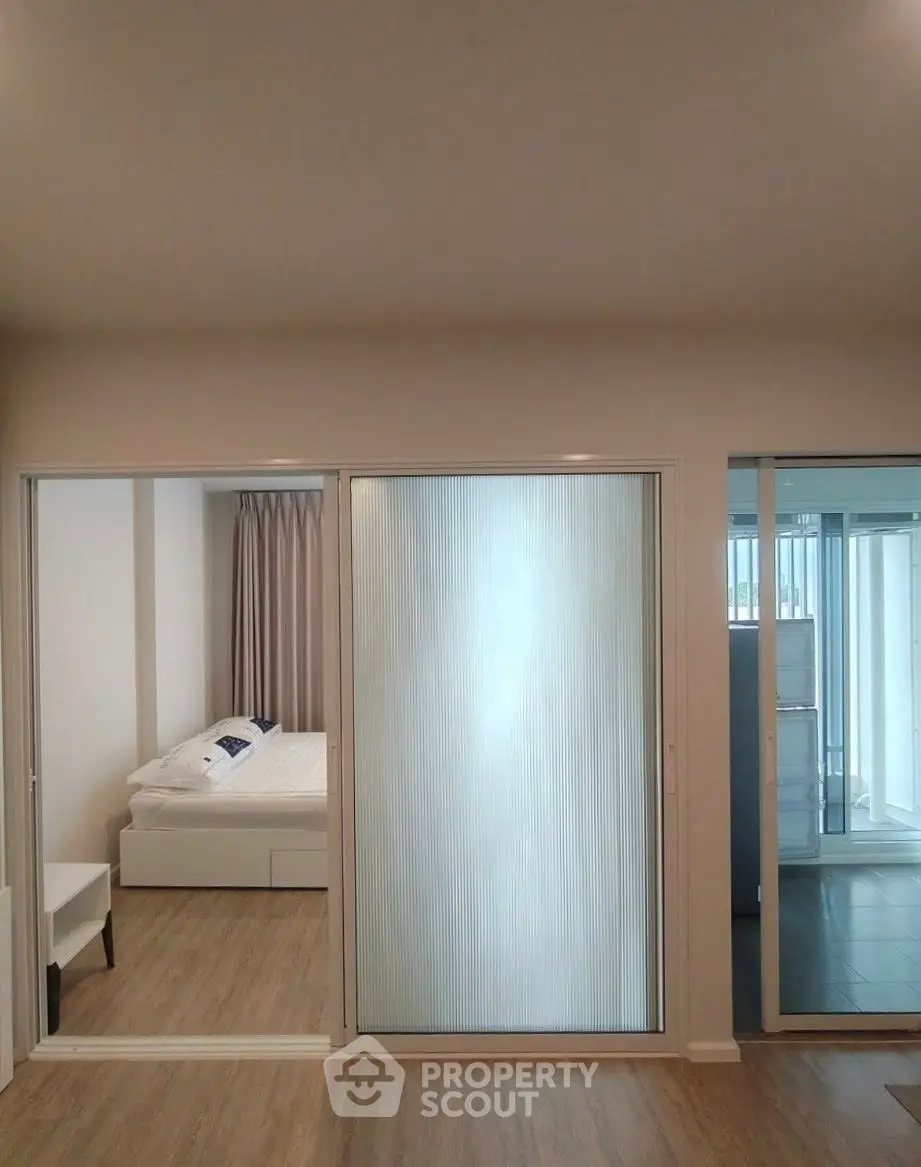 Modern apartment with sliding doors and cozy bedroom