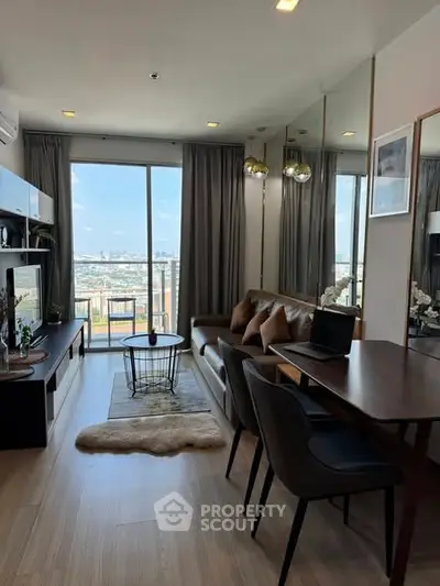 Modern living room with city view, stylish furniture, and natural light.