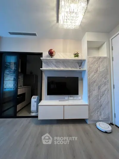 Modern living room with sleek TV unit and elegant lighting