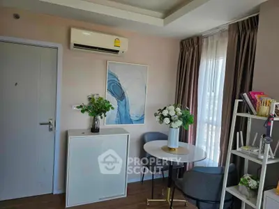 Charming small living area with modern decor and natural light