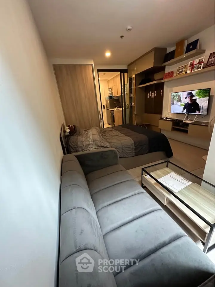 Modern studio apartment with cozy living area and stylish decor