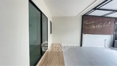 Spacious modern balcony with sleek design and wooden accents