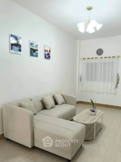Modern living room with stylish beige sofa and elegant decor