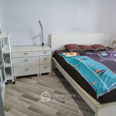 Cozy bedroom with modern furniture and stylish flooring