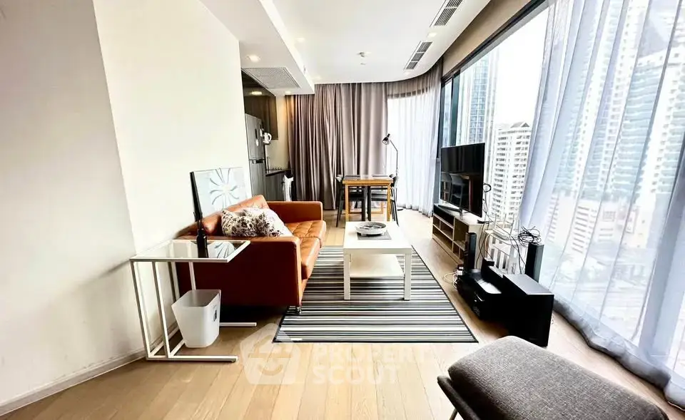 Spacious modern living room with floor-to-ceiling windows and city view