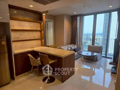 Modern open-plan living room with city view and stylish kitchen