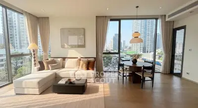 Spacious modern living room with city view and elegant decor