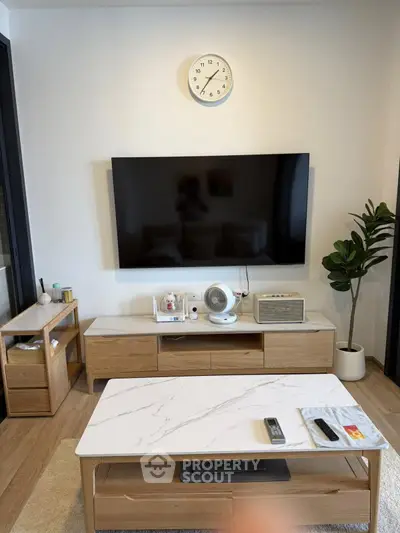 Modern living room with sleek TV setup and stylish furniture