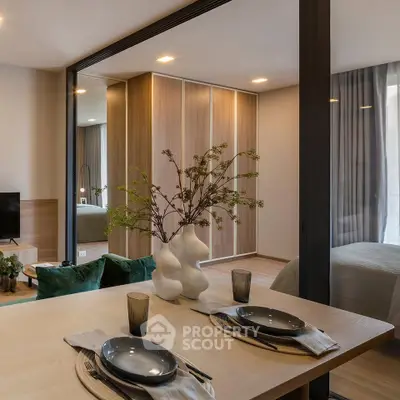 Modern open-plan living and dining area with stylish decor and natural light.