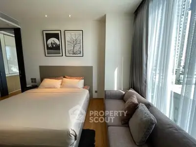Modern bedroom with large windows and stylish decor in urban apartment