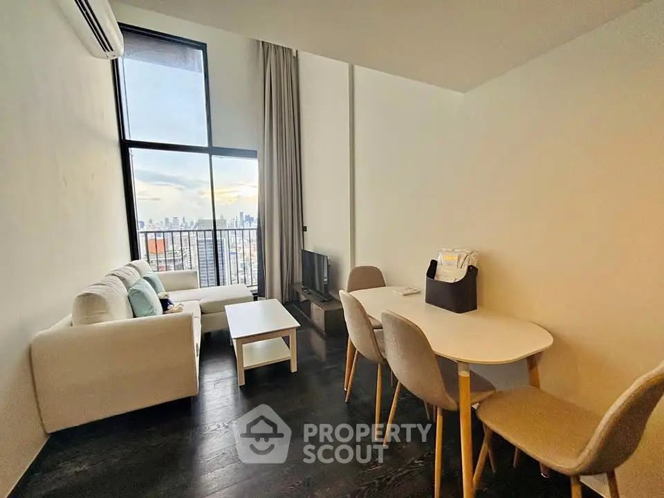 Modern living room with high ceiling and city view from large windows
